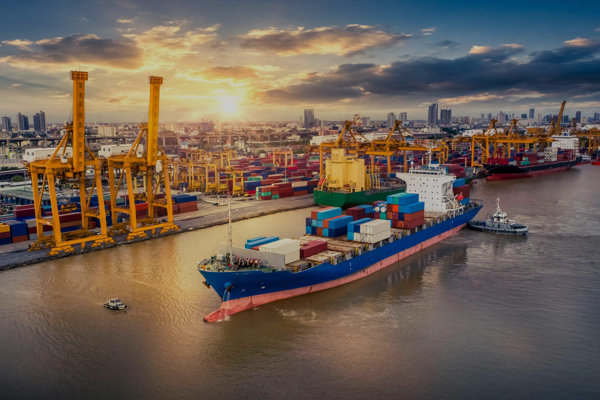 Container vessel berthed at a terminal at sunrise